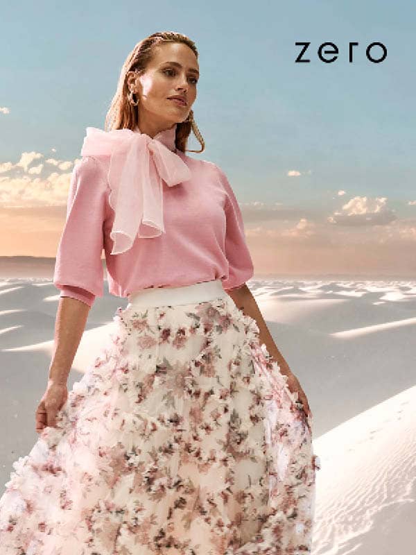 Frau am Meer mit Rueschenkleid